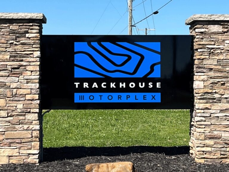The sign that hangs at the entrance of the Trackhouse Motorplex.
